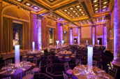 event venue room with neon lights and round tables