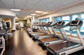 black and gray treadmills in a gym